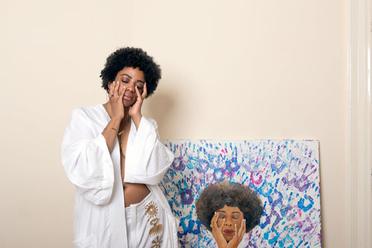 Photography of Artist Antonia (Amja) Lee (taken by photographer Lewis Patrick)  beside her original fine art work "Your Hands" 